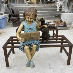 reading girl with dog statue