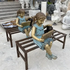 reading girl with dog statue