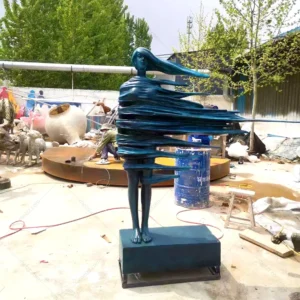 woman in the wind sculpture