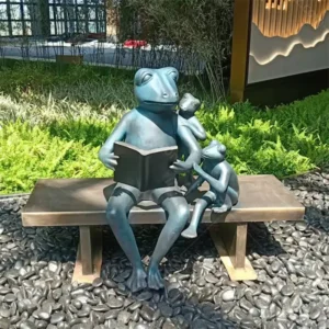 reading frog garden statue