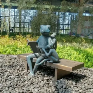 reading frog garden statue