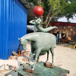 child and horse statue