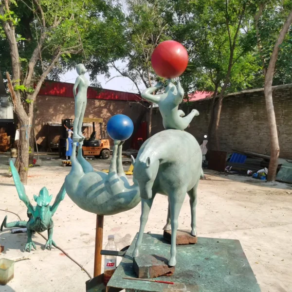 child and horse statue