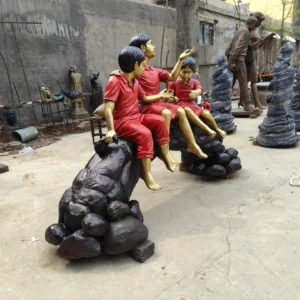 three children on log statue