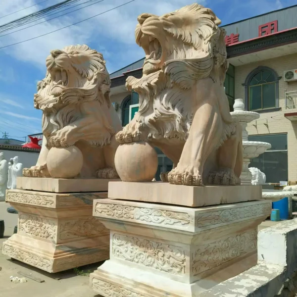 lion holding ball statue