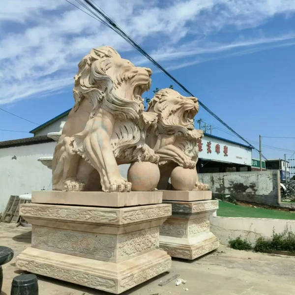 lion holding ball statue