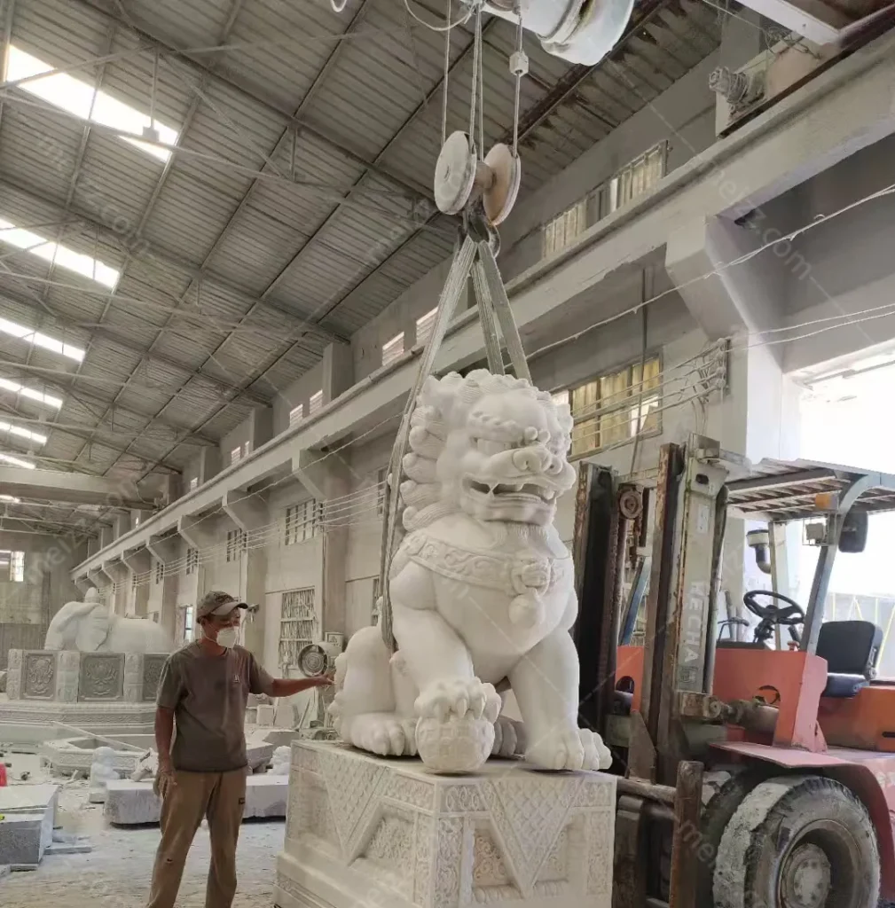 lion statue with ball meaning