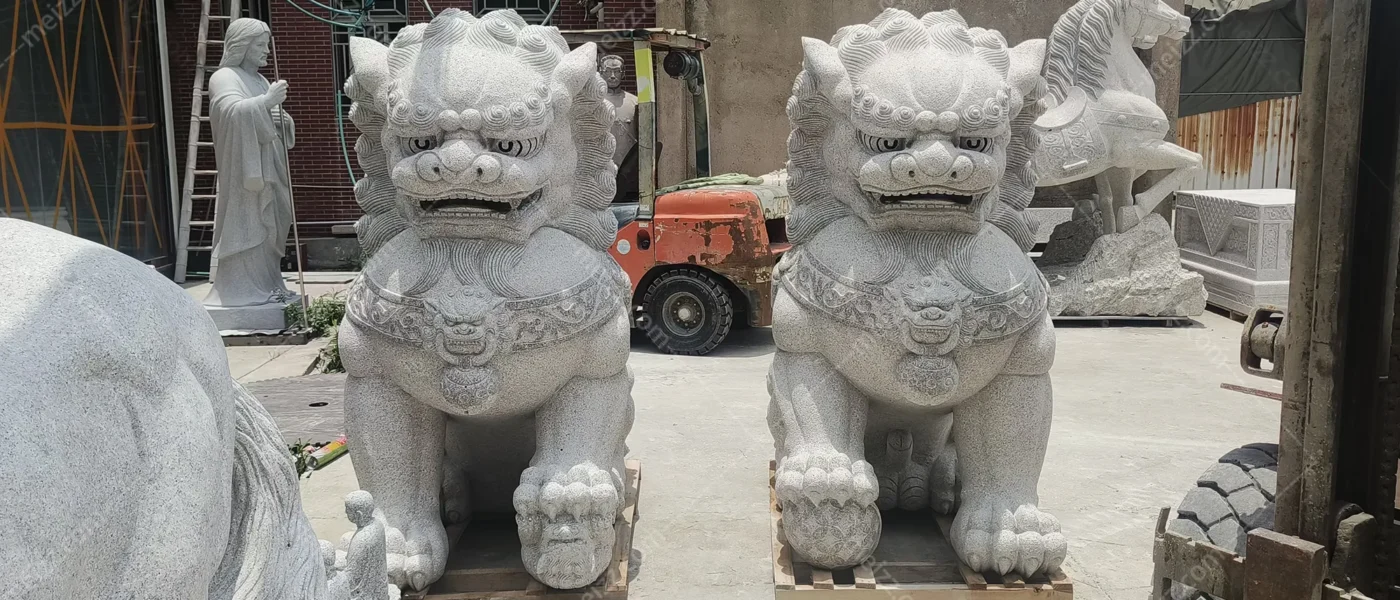 lion statue with ball meaning