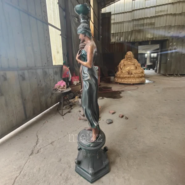 woman statue lamp