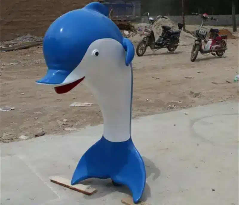 A dolphin sculpture placed in the bathroom.