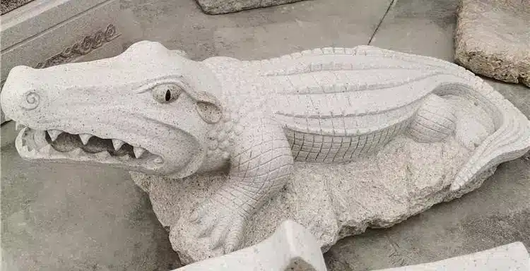 Stone crocodile sculpture