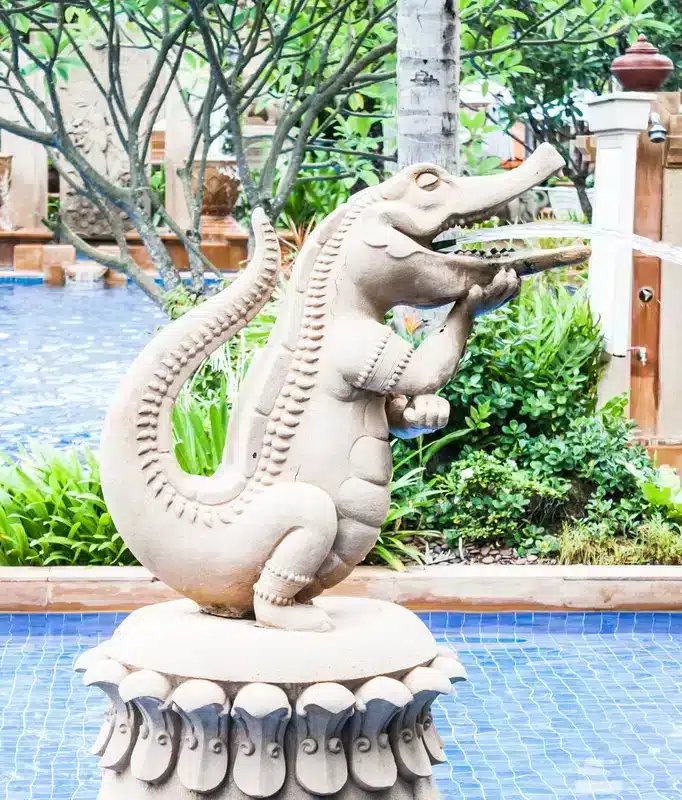 Stone carved crocodile fountain